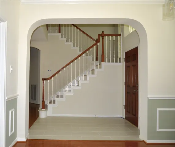 a view of staircase with wooden floor and stairs