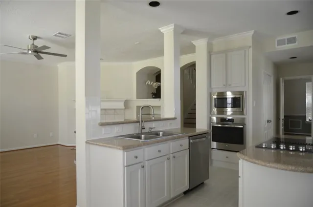 a bathroom with a granite countertop sink double vanity and a mirror