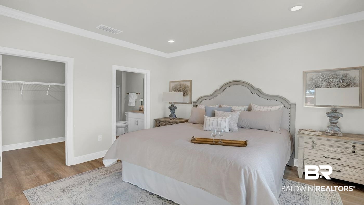 13312 Shea Circle Foley, AL 36535 - Photo 13 of 17 Spacious room featuring wood-finish flooring, recessed lighting, and crown molding