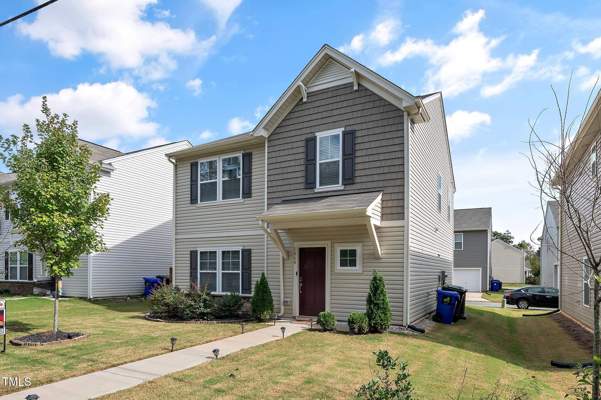 1060 North Gibson Road Mebane, NC 27302 - Photo 1 of 34 a front view of a house with a yard