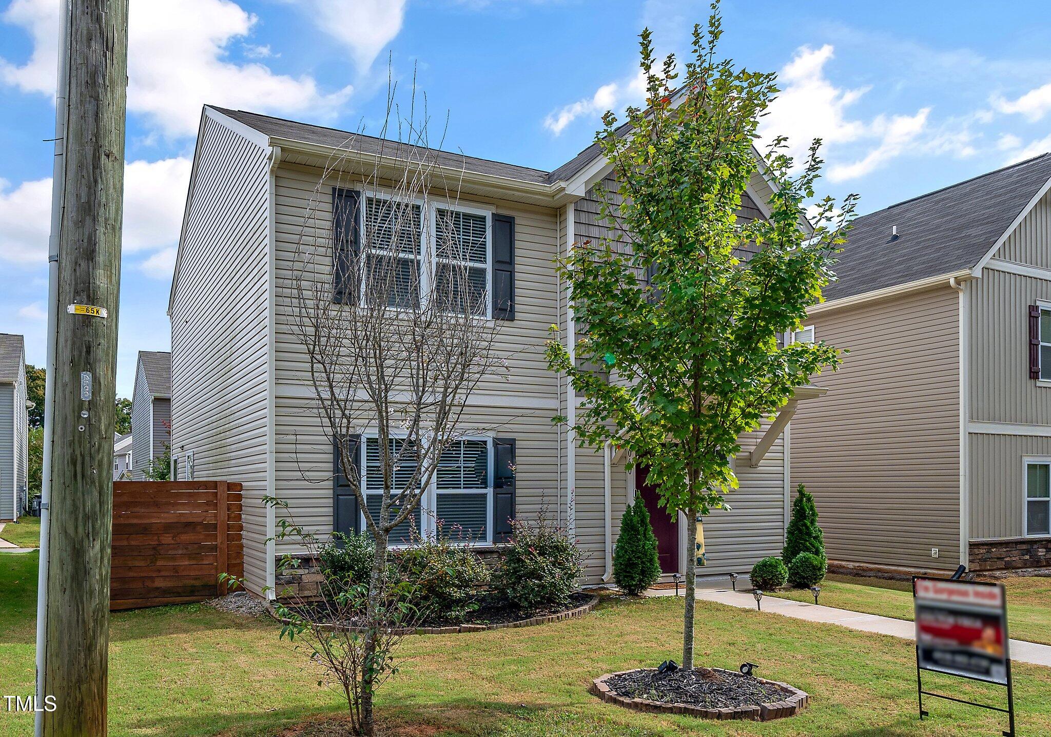 1060 North Gibson Road Mebane, NC 27302 - Photo 2 of 34 a front view of a house with a yard