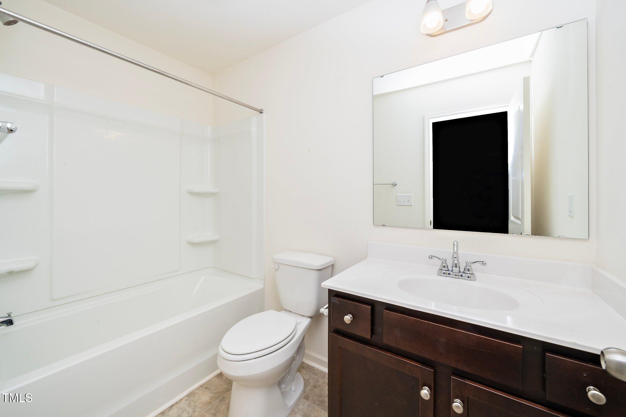 1060 North Gibson Road Mebane, NC 27302 - Photo 22 of 34 a bathroom with a sink a toilet and shower