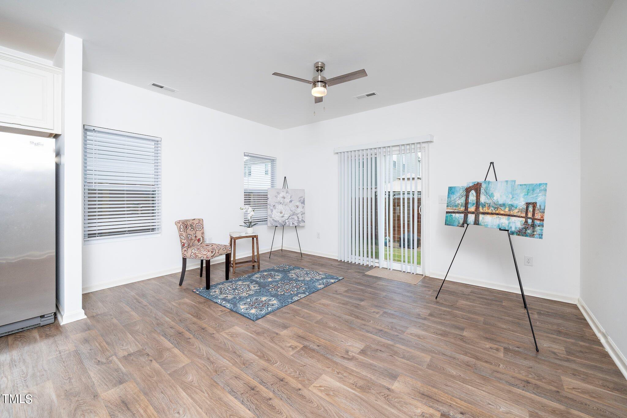 1060 North Gibson Road Mebane, NC 27302 - Photo 8 of 34 a living room with furniture and a table with wooden floor