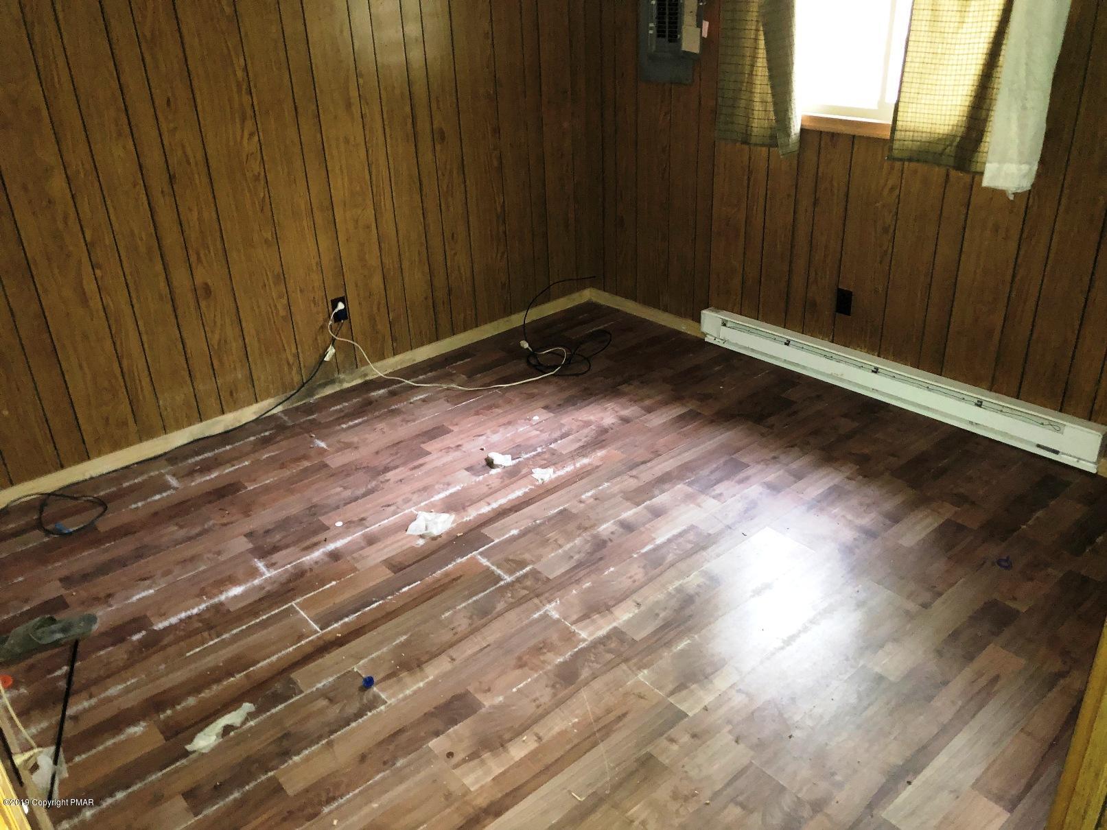 106 Elk Run Road Pocono Lake, PA 18347 - Photo 11 of 11 a view of an empty room with wooden floor