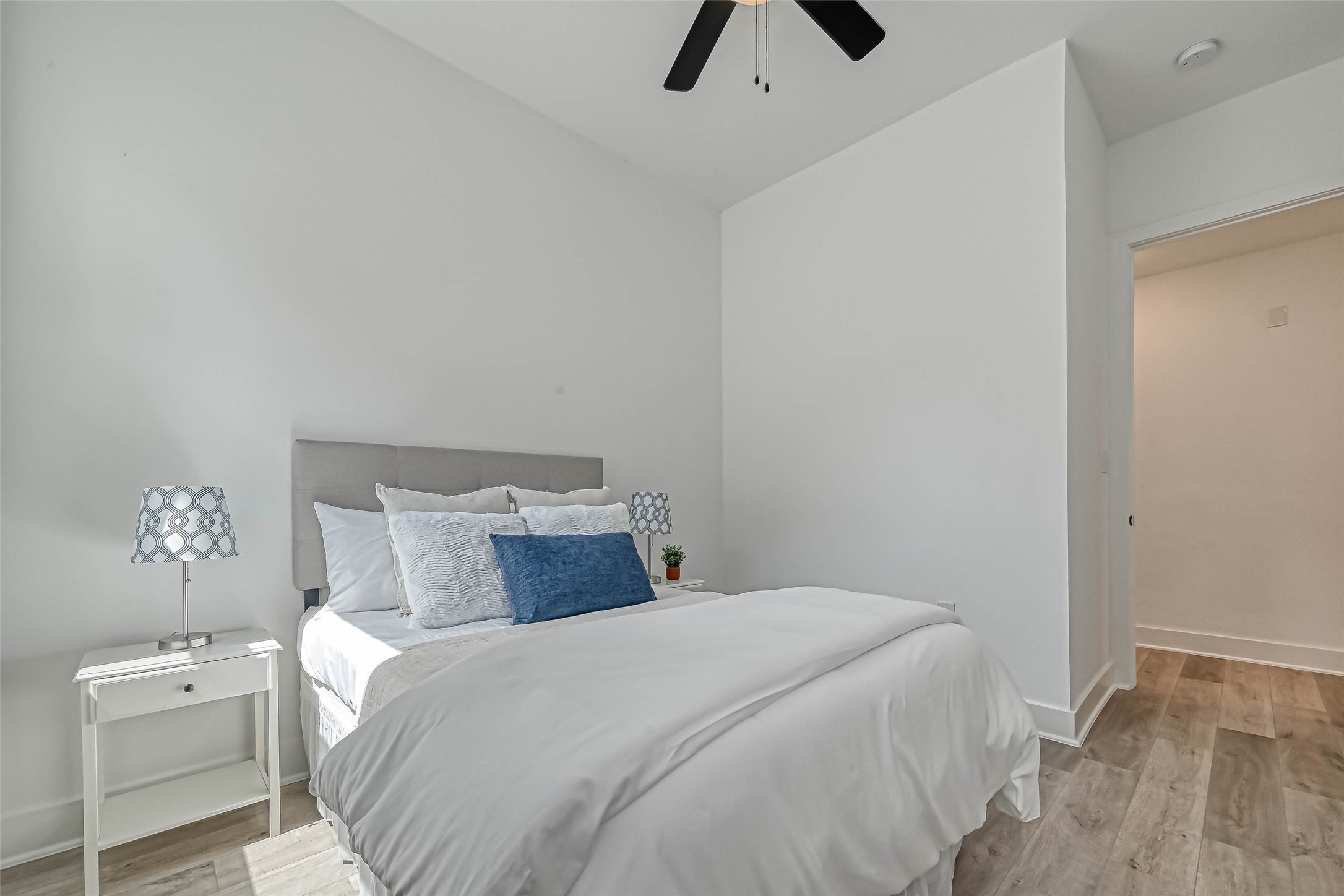 9316 Arledge Street, Unit B Houston, TX 77075 - Photo 12 of 26 a bedroom with a bed and cabinets