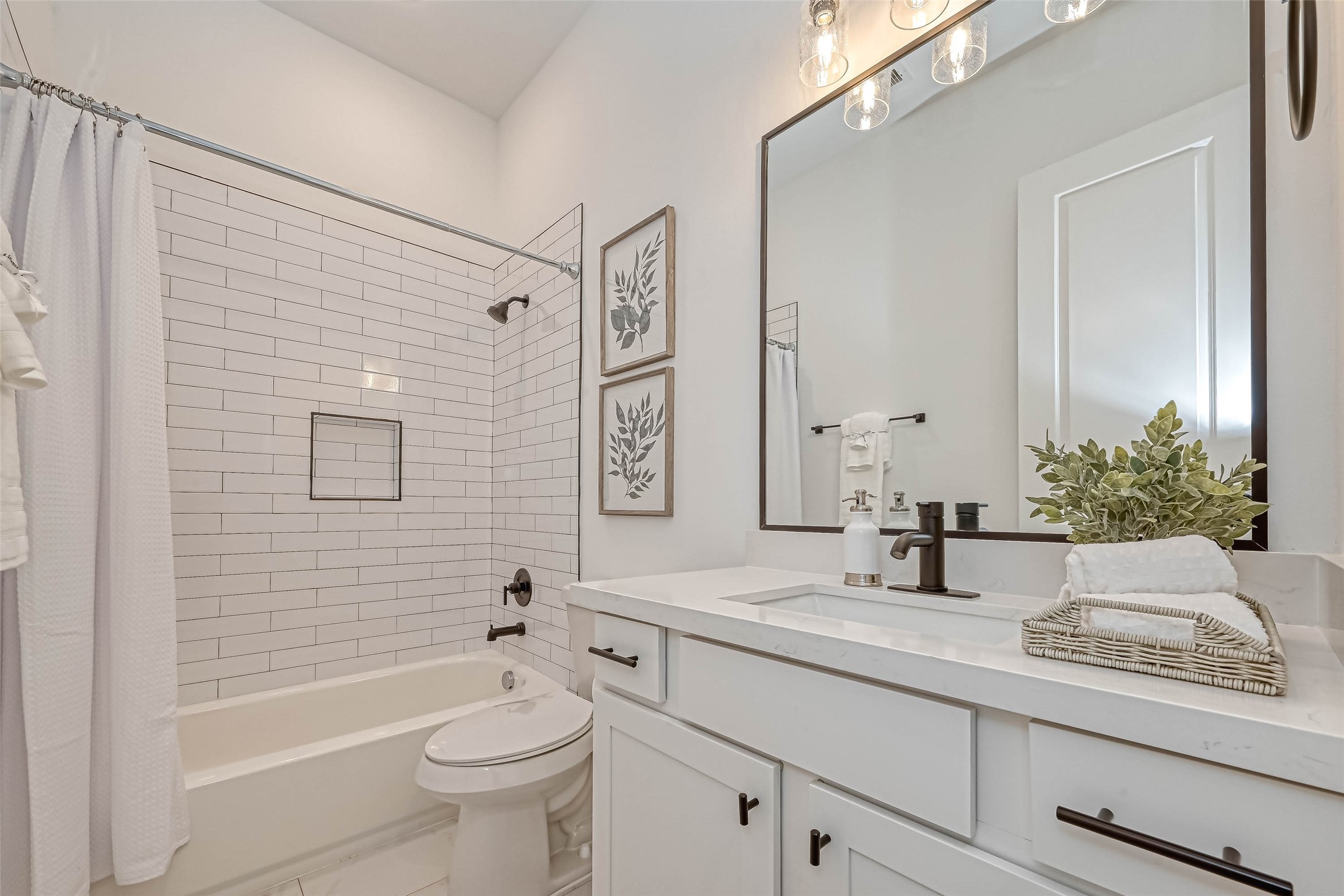 9316 Arledge Street, Unit B Houston, TX 77075 - Photo 13 of 26 a bathroom with a sink a toilet and shower