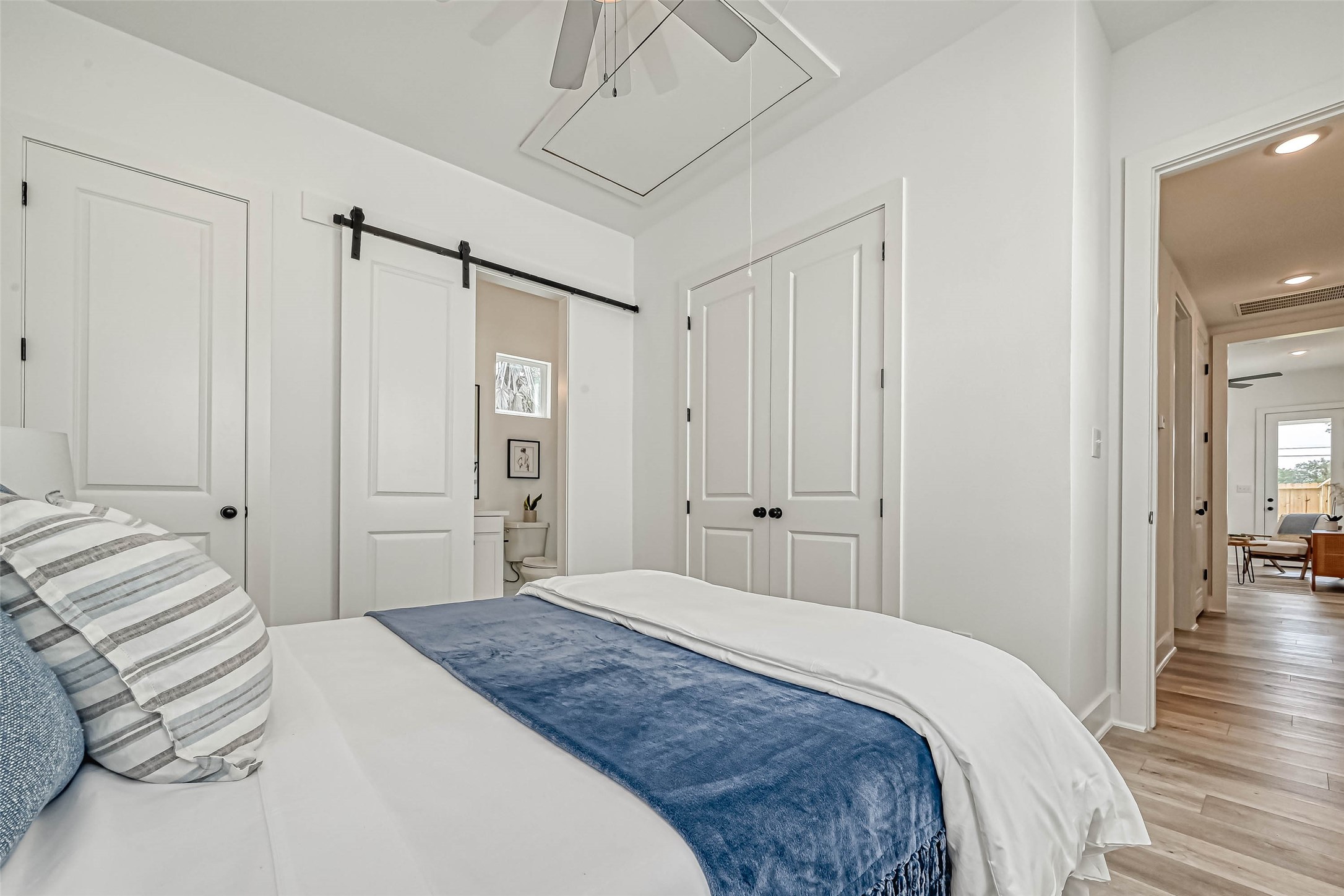 9316 Arledge Street, Unit B Houston, TX 77075 - Photo 15 of 26 a bedroom with a large bed and wooden floor