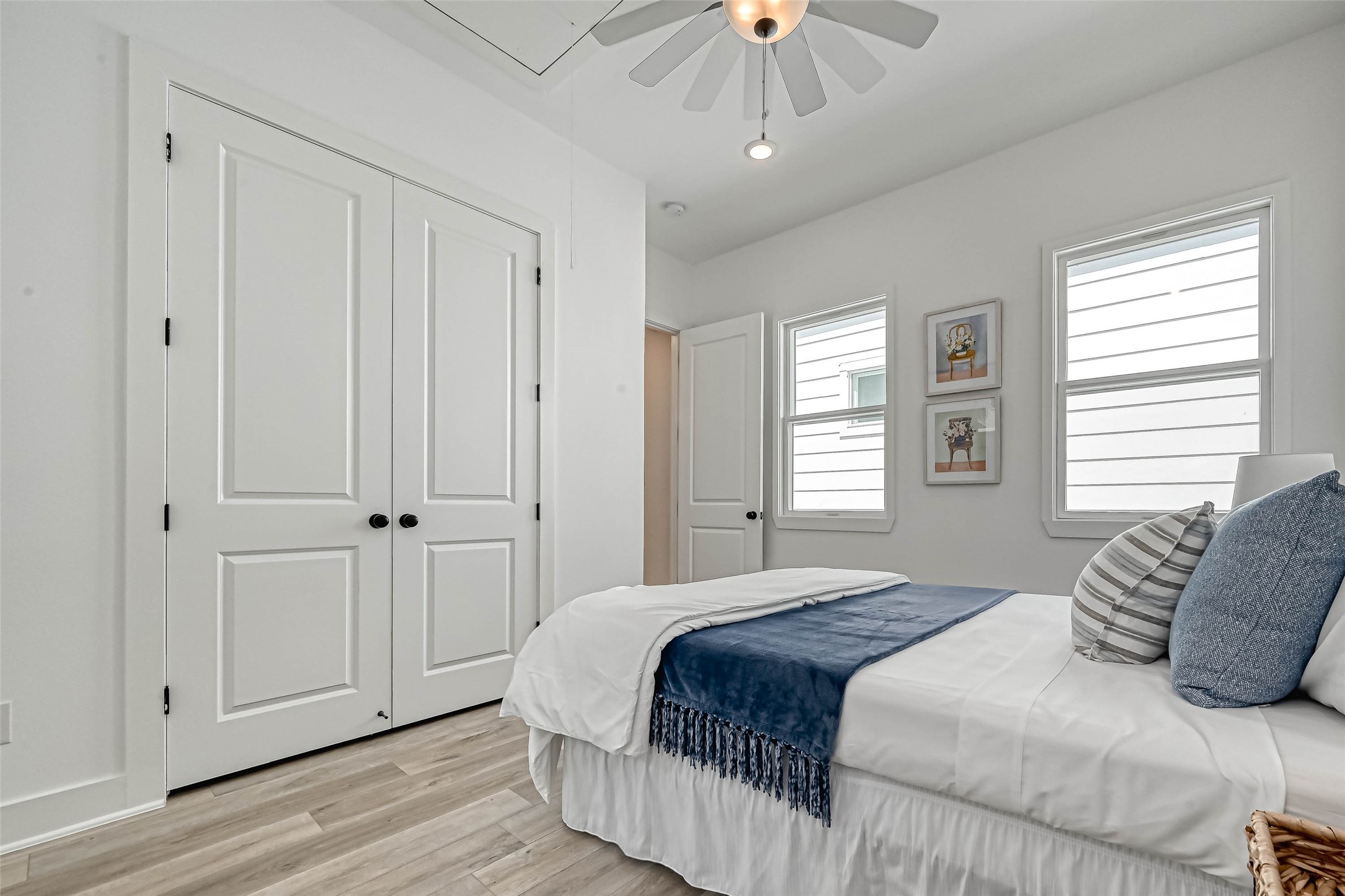 9316 Arledge Street, Unit B Houston, TX 77075 - Photo 16 of 26 a bedroom with a large bed and a chandelier