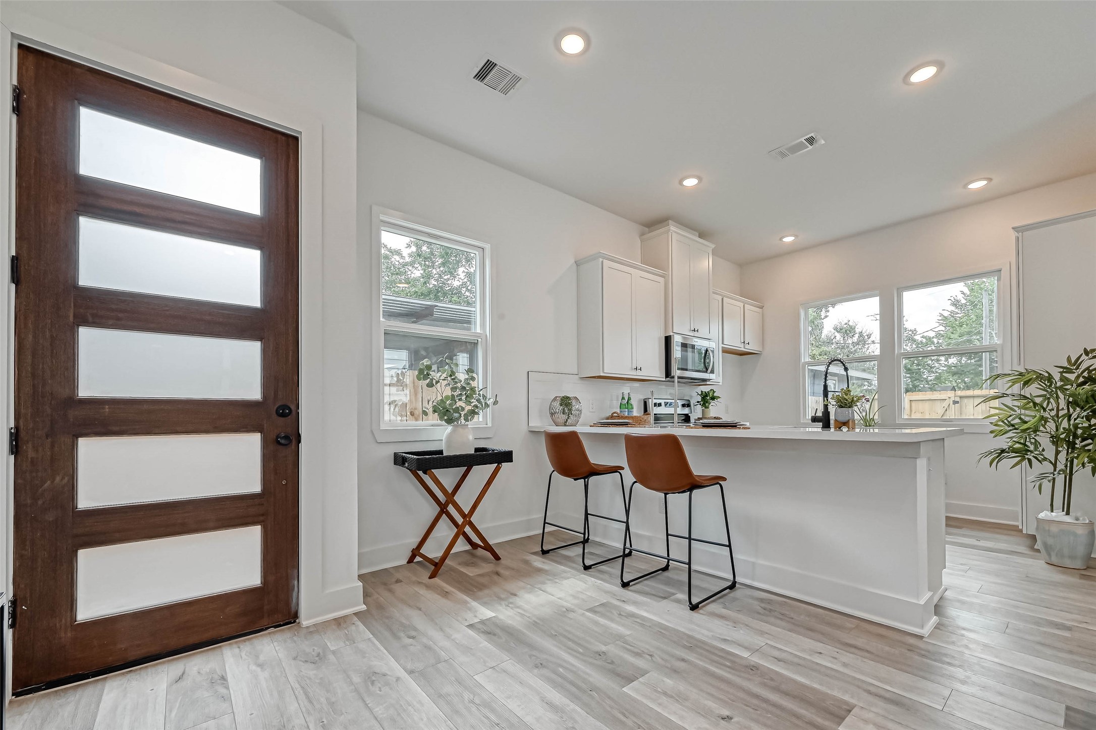 9316 Arledge Street, Unit B Houston, TX 77075 - Photo 2 of 26 a view of a dining room with furniture and wooden floor