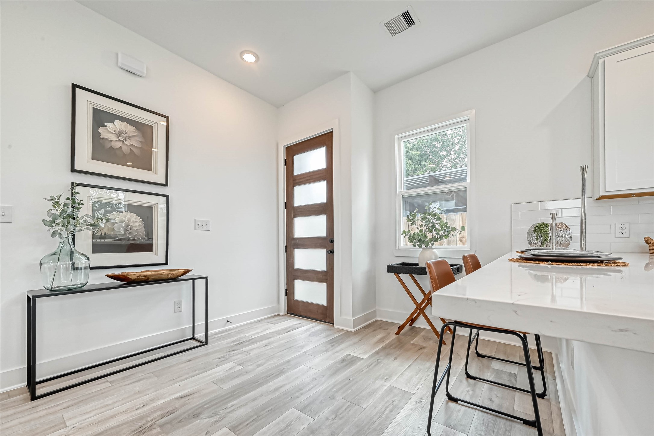 9316 Arledge Street, Unit B Houston, TX 77075 - Photo 4 of 26 a view of a workspace with furniture and a window