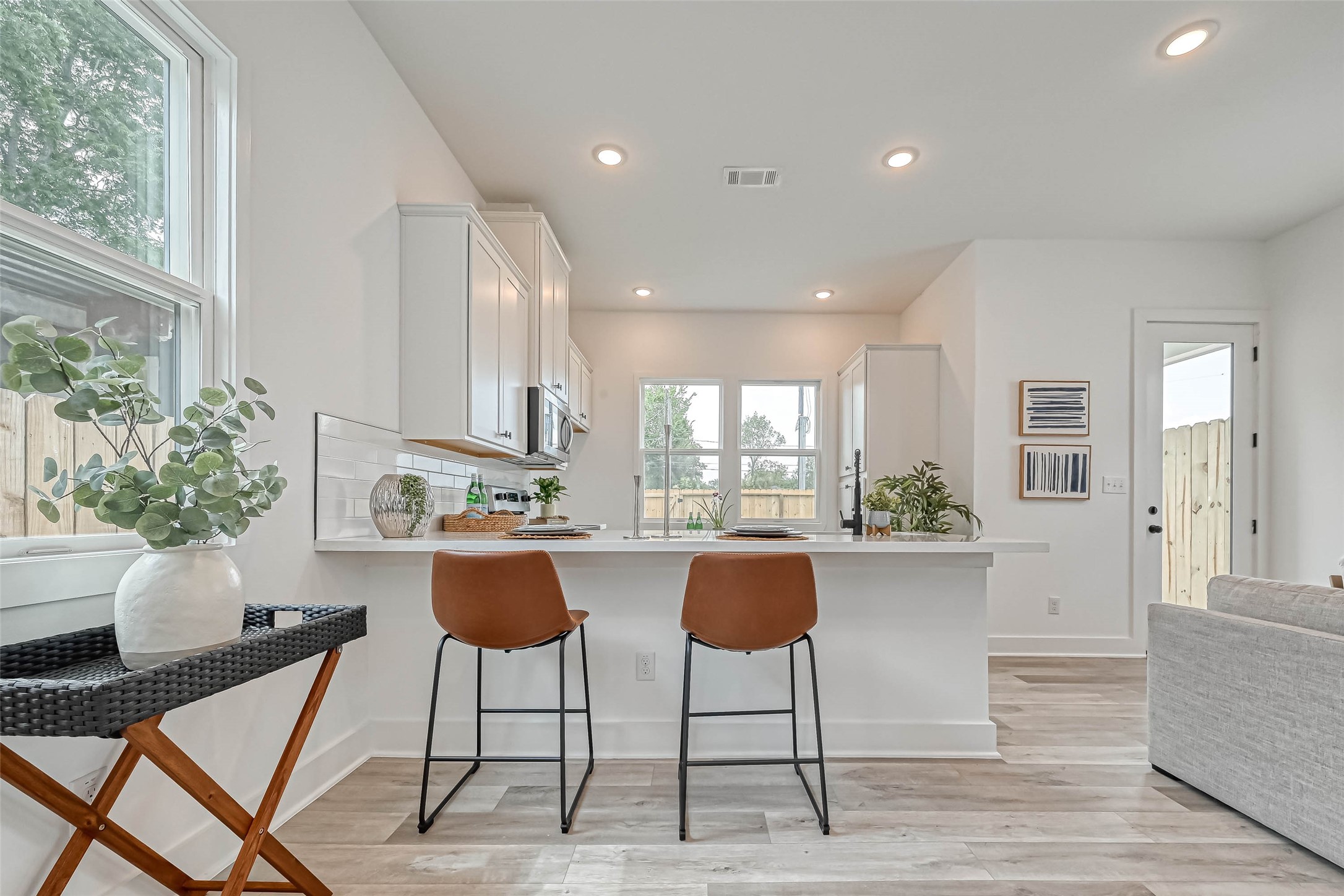 9316 Arledge Street, Unit B Houston, TX 77075 - Photo 6 of 26 a kitchen with stainless steel appliances kitchen island a large window in it and kitchen view