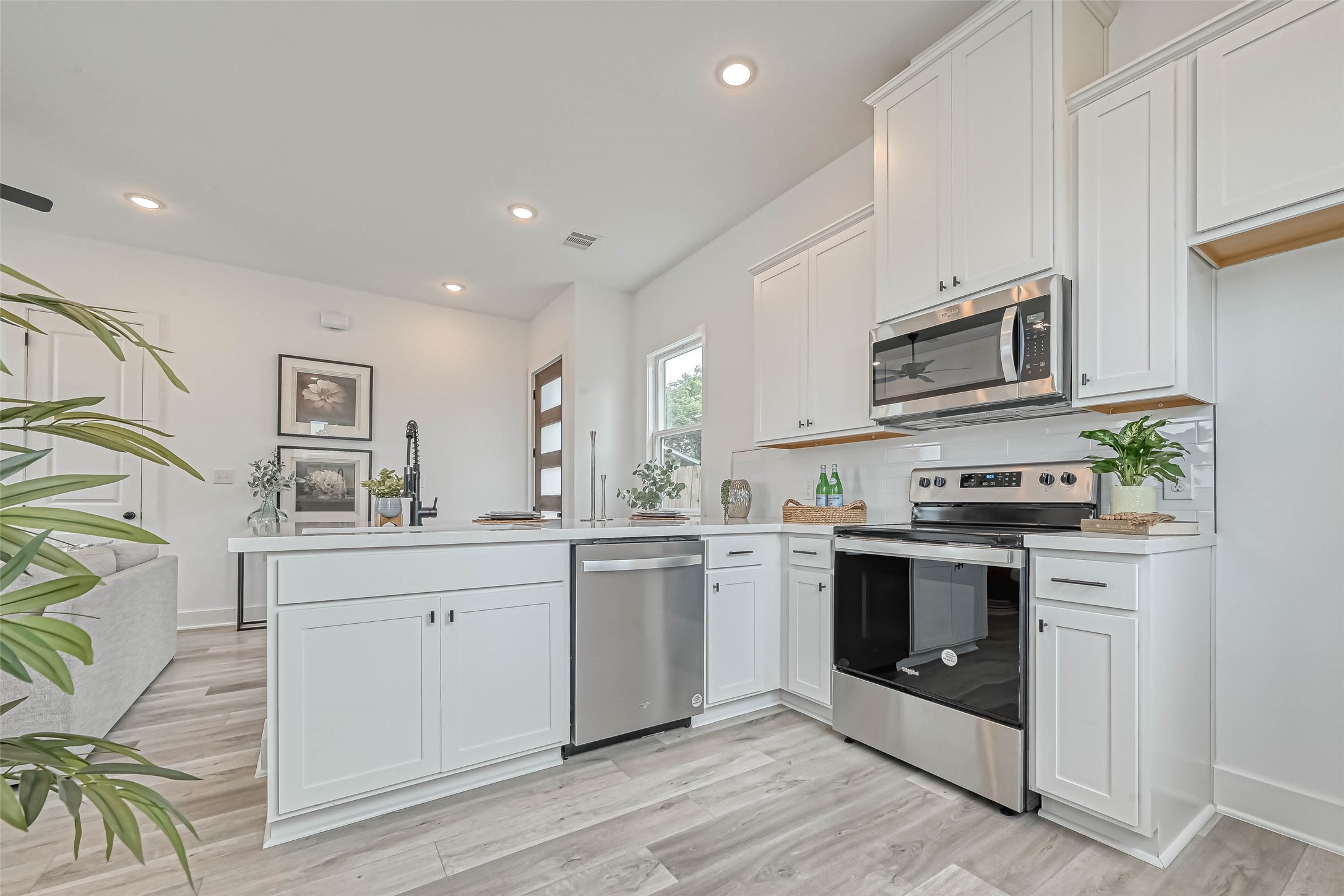 9316 Arledge Street, Unit B Houston, TX 77075 - Photo 7 of 26 a kitchen with stainless steel appliances granite countertop a stove and a sink