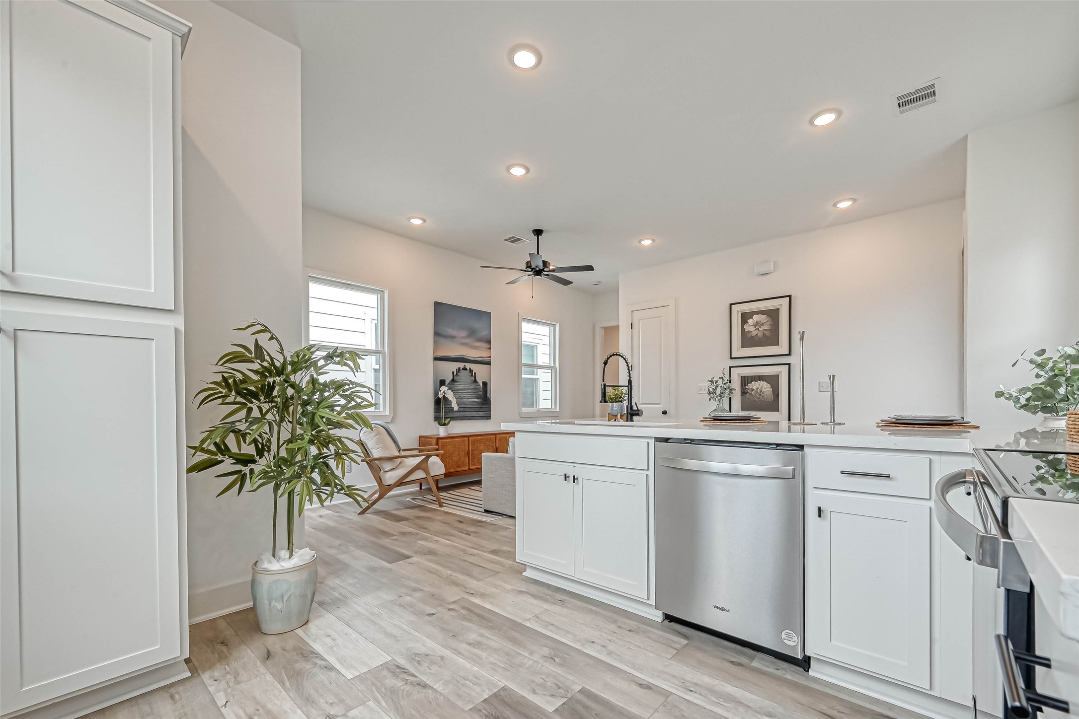 9316 Arledge Street, Unit B Houston, TX 77075 - Photo 8 of 26 a kitchen with white cabinets and a potted plant