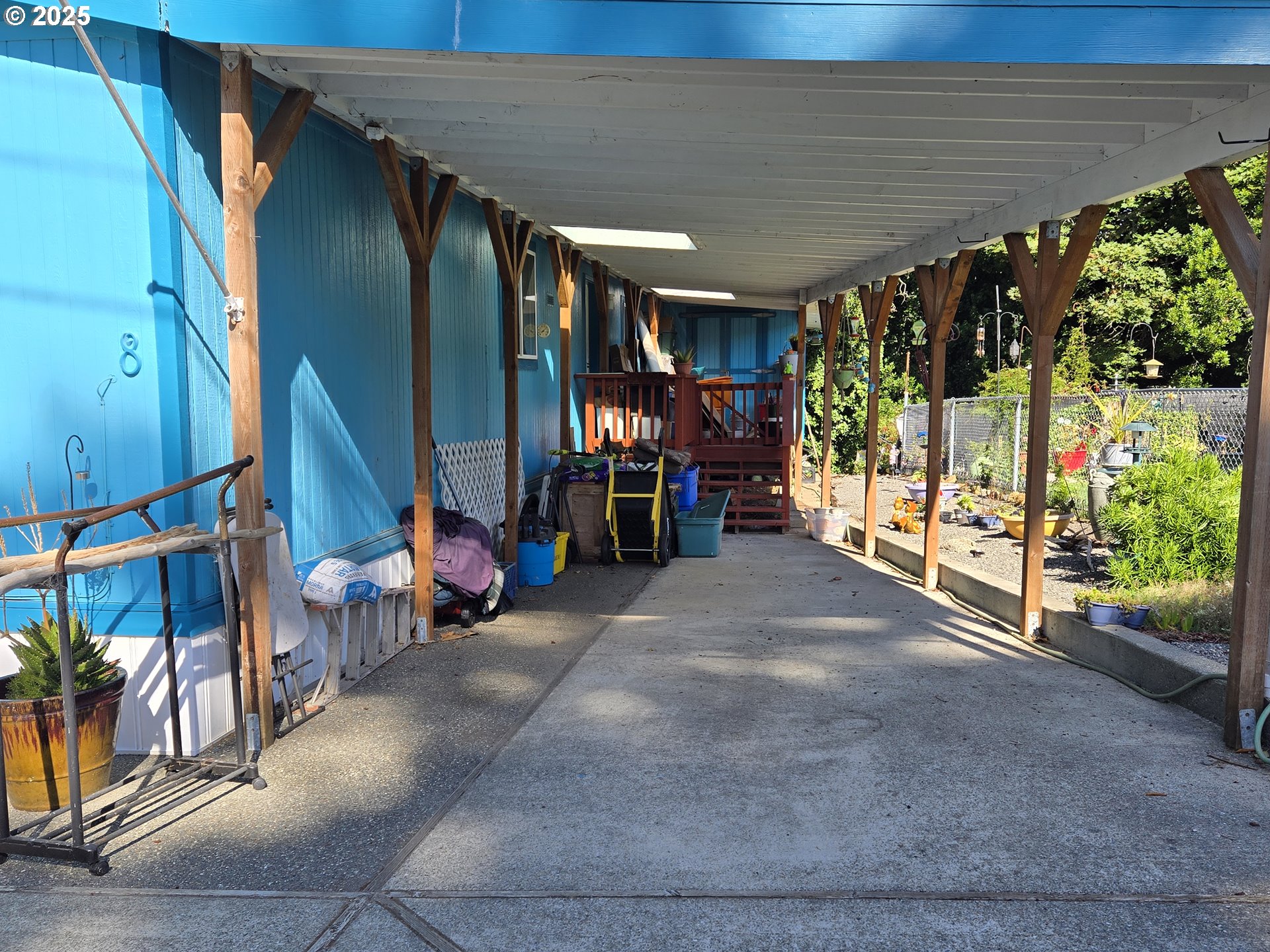 96465 Coverdell Road, Unit 8 Brookings, OR 97415 - Photo 13 of 42 a view of a garage with chairs