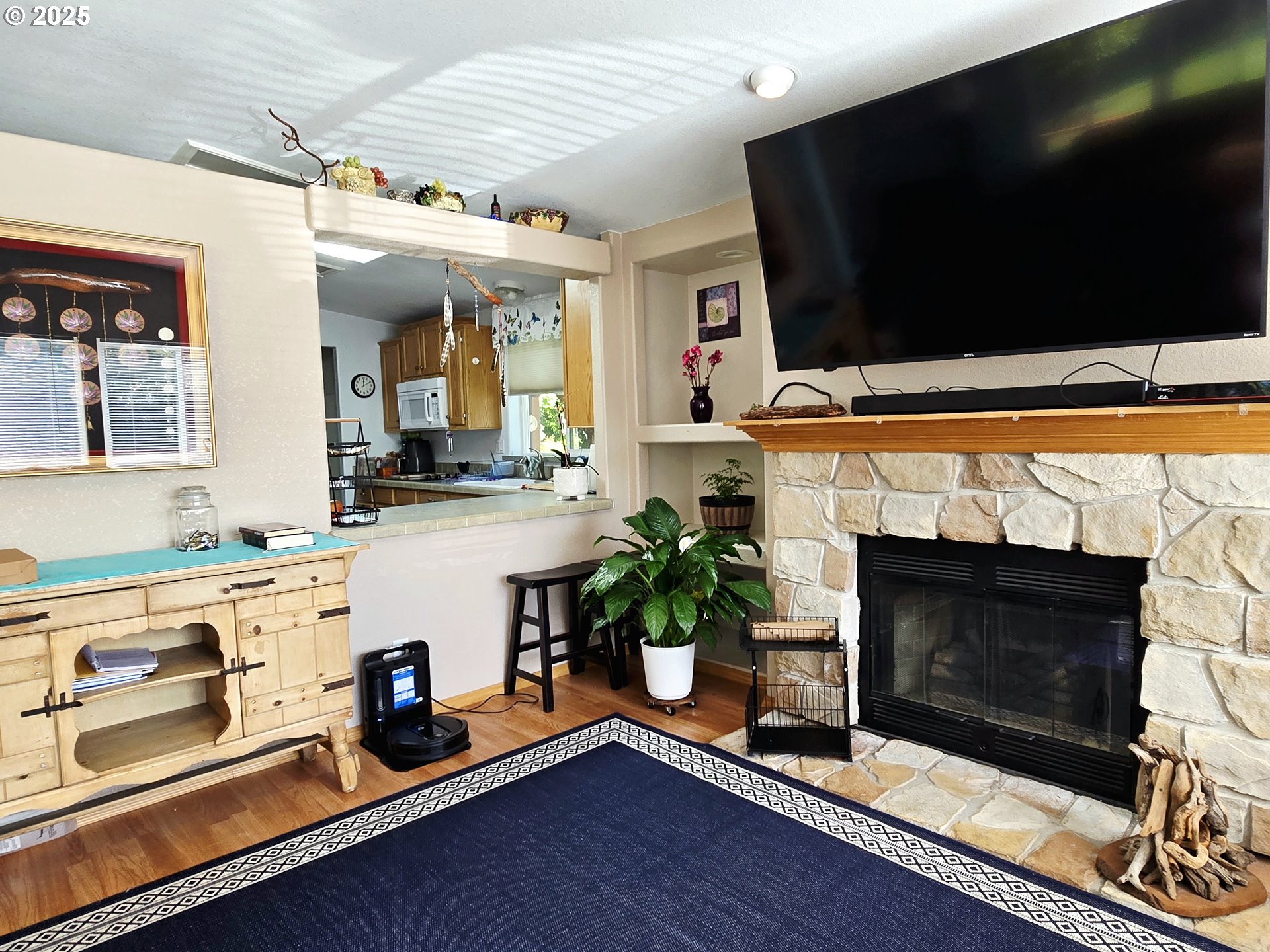 96465 Coverdell Road, Unit 8 Brookings, OR 97415 - Photo 18 of 42 a living room with furniture fireplace and flat screen tv