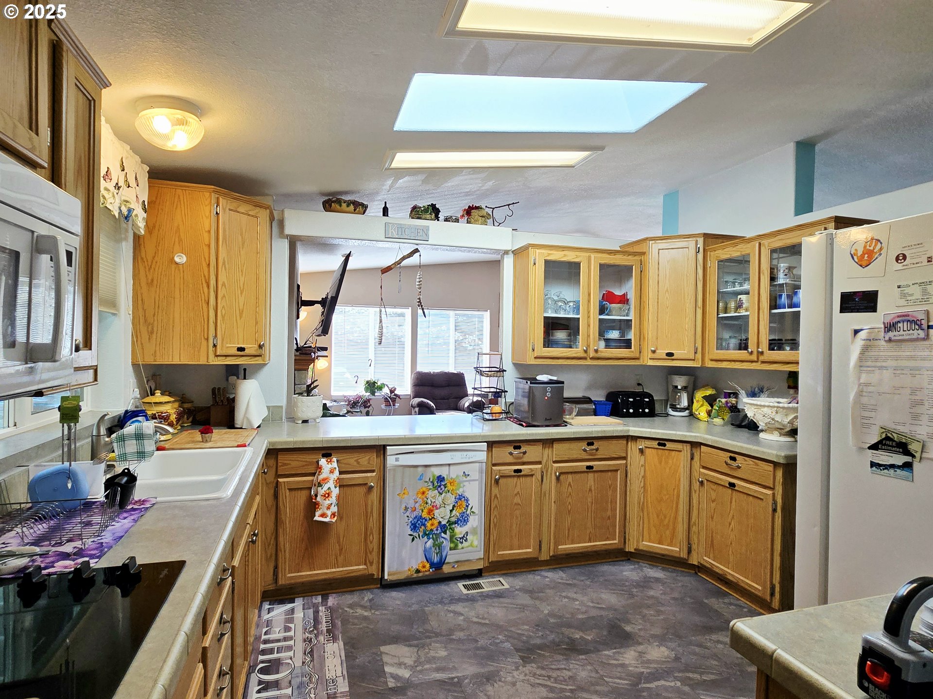 96465 Coverdell Road, Unit 8 Brookings, OR 97415 - Photo 21 of 42 a kitchen with a sink stove and cabinets
