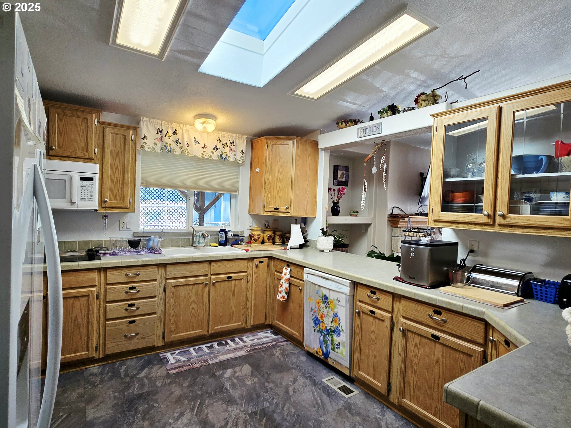 96465 Coverdell Road, Unit 8 Brookings, OR 97415 - Photo 24 of 42 a kitchen with stainless steel appliances sink stove and cabinets