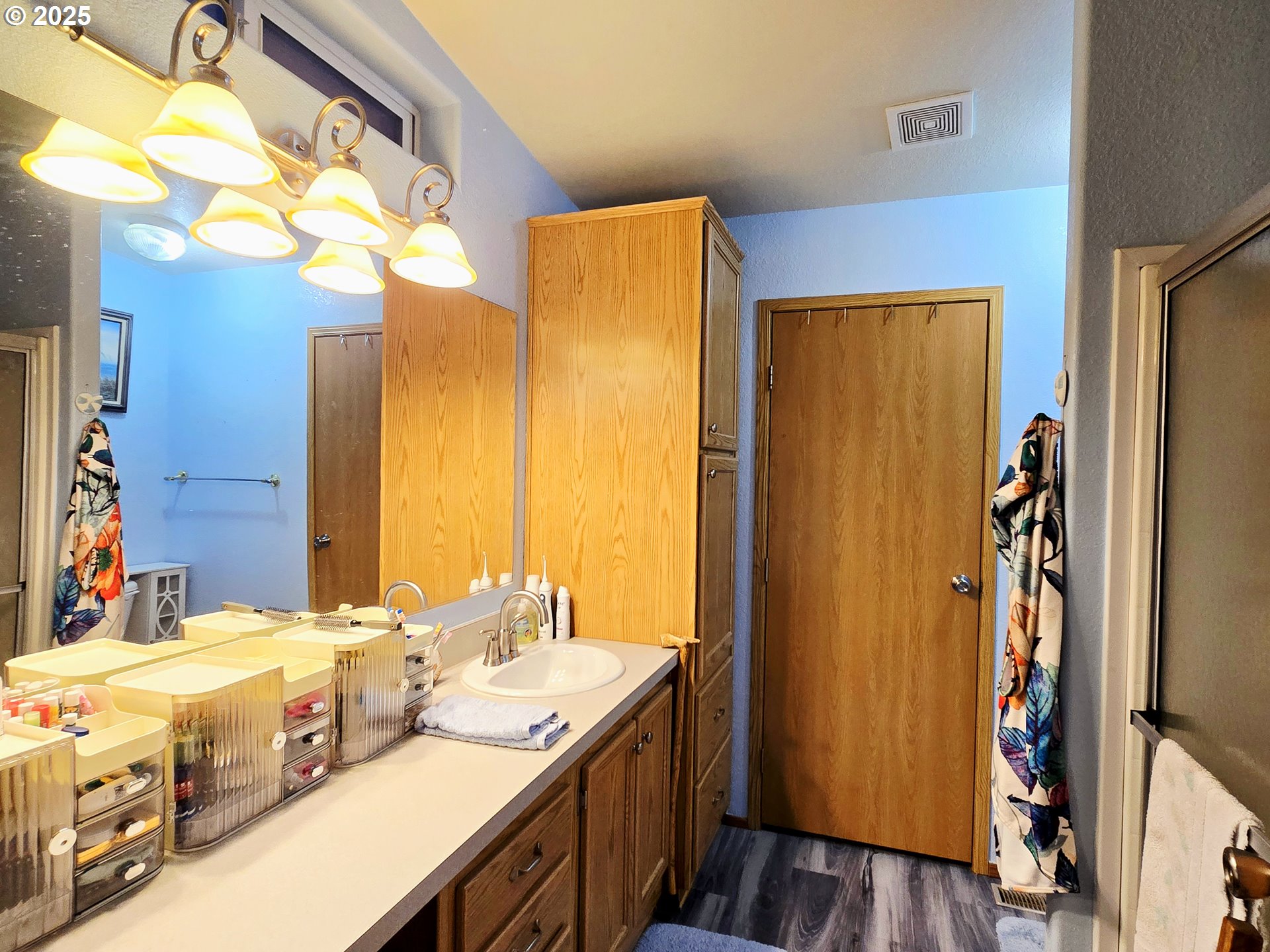 96465 Coverdell Road, Unit 8 Brookings, OR 97415 - Photo 30 of 42 a bathroom with a double vanity sink and a mirror