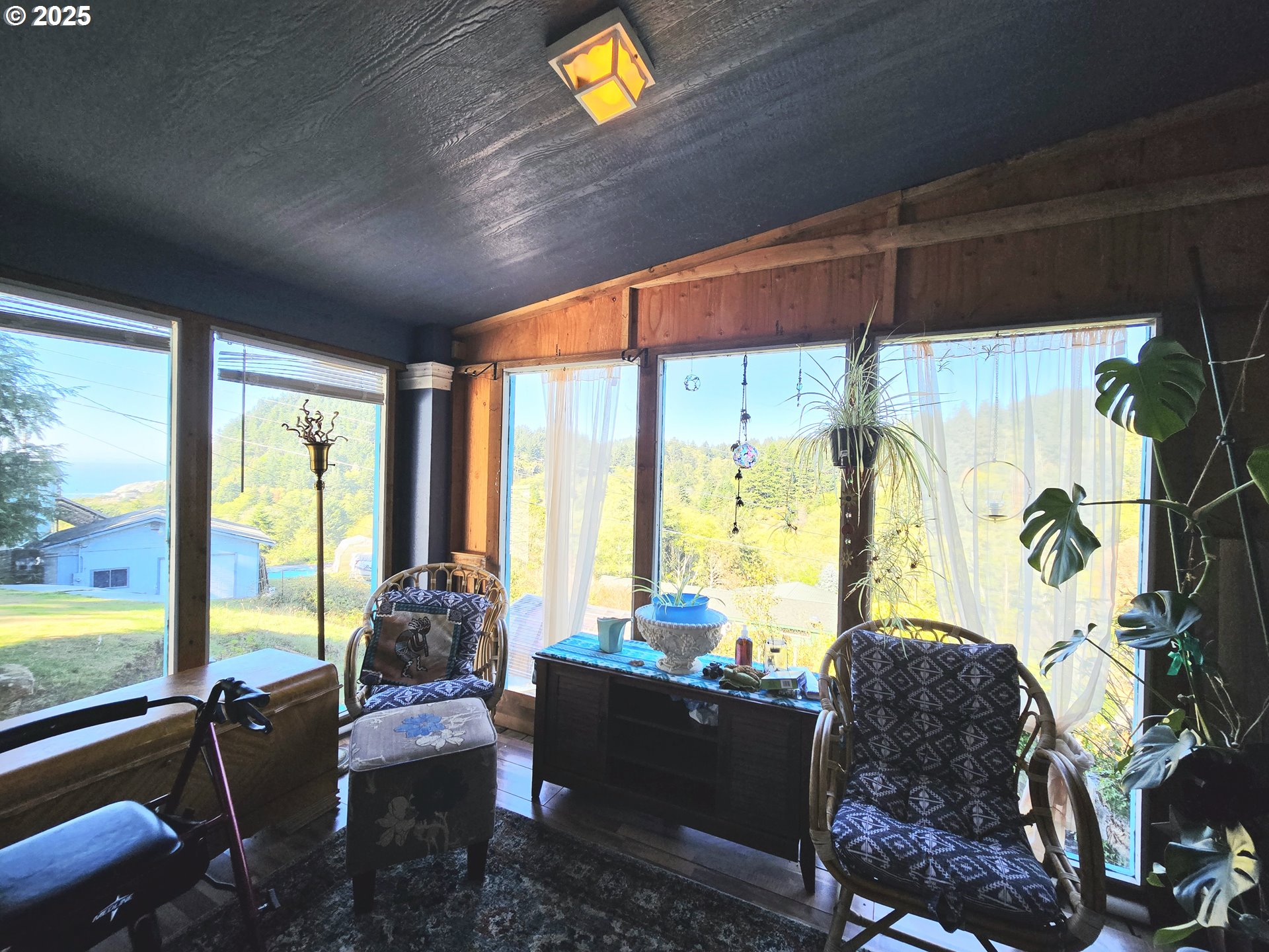 96465 Coverdell Road, Unit 8 Brookings, OR 97415 - Photo 32 of 42 a living room with furniture and a large window