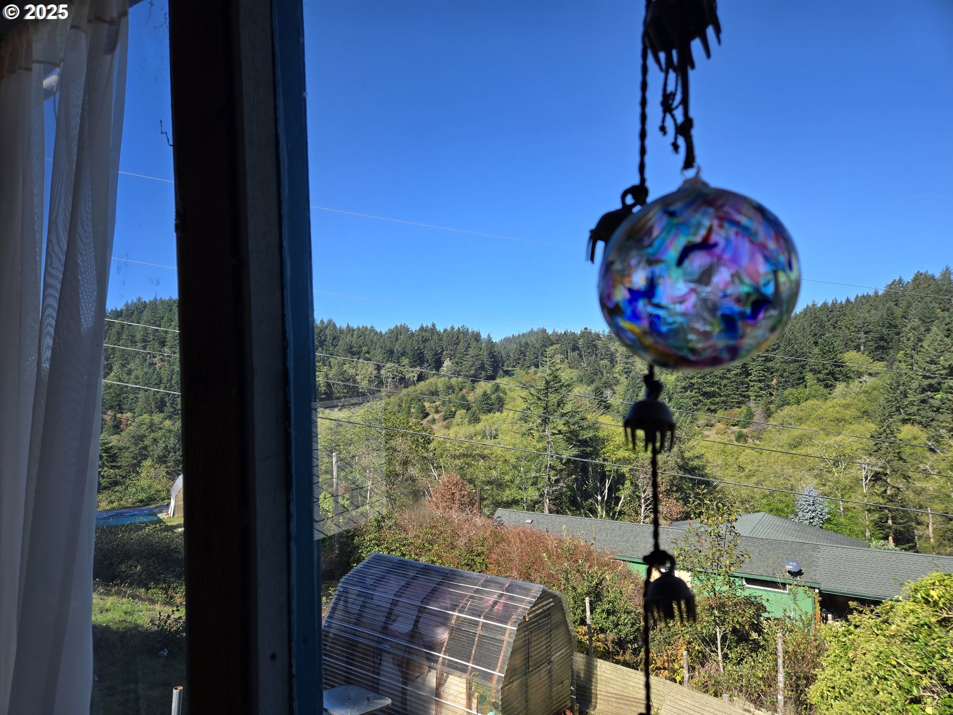 96465 Coverdell Road, Unit 8 Brookings, OR 97415 - Photo 36 of 42 a view of a balcony with table and chairs