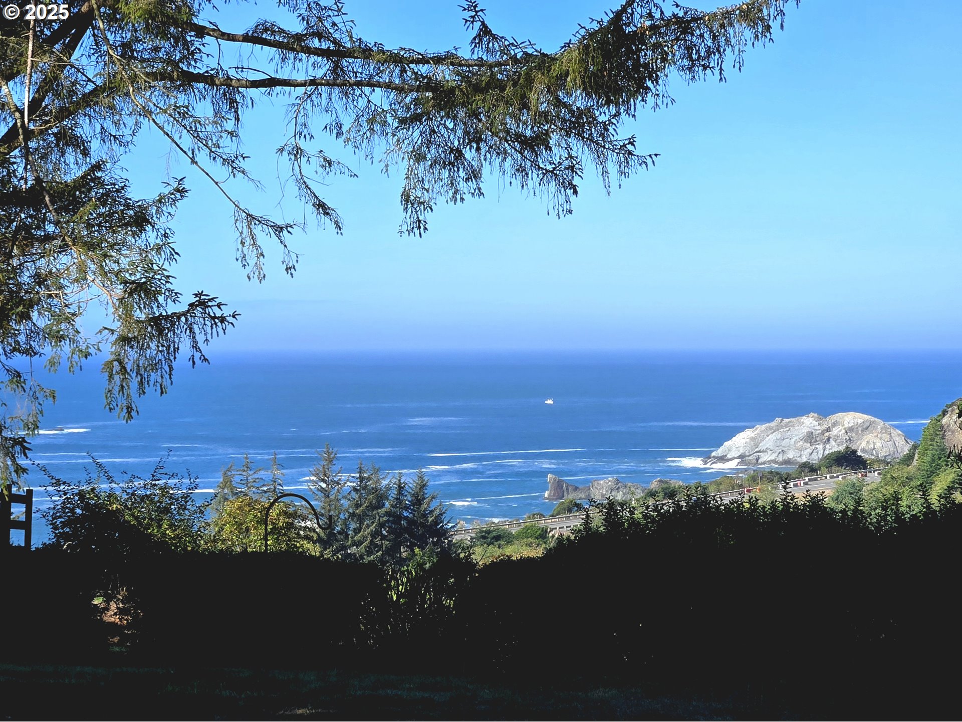 96465 Coverdell Road, Unit 8 Brookings, OR 97415 - Photo 4 of 42 a view of a lake with a mountain