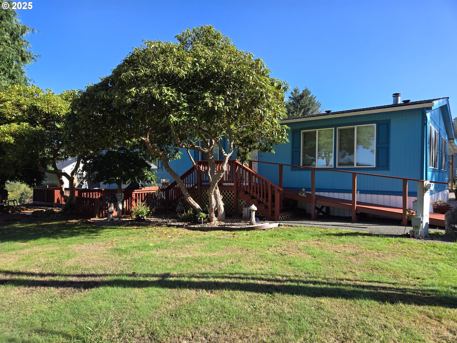 96465 Coverdell Road, Unit 8 Brookings, OR 97415 - Photo 7 of 42 a view of a house with a yard