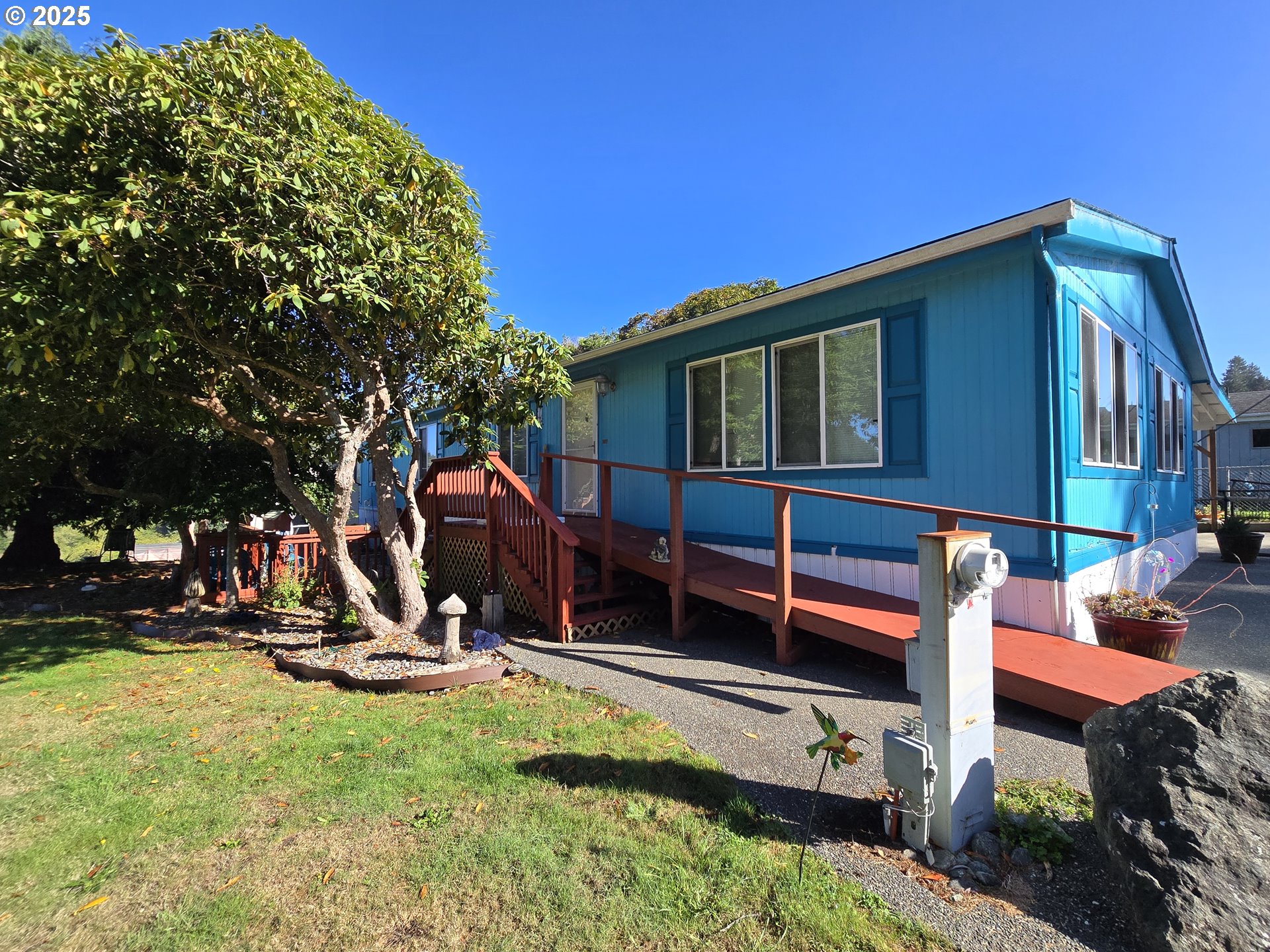 96465 Coverdell Road, Unit 8 Brookings, OR 97415 - Photo 10 of 42 a view of a house with backyard and sitting area