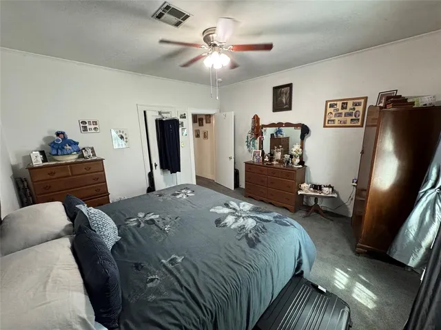 a bed room with a bed and a television