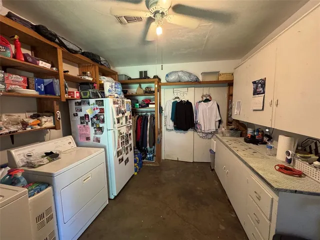 a view of an entryway with a table and chair