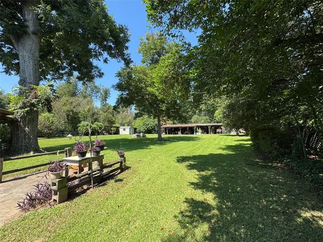 a view of outdoor space with deck and yard