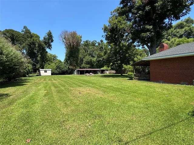 a view of house with yard