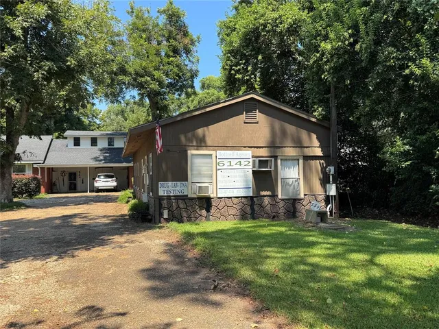 a living room with lots of furniture and a flat screen tv