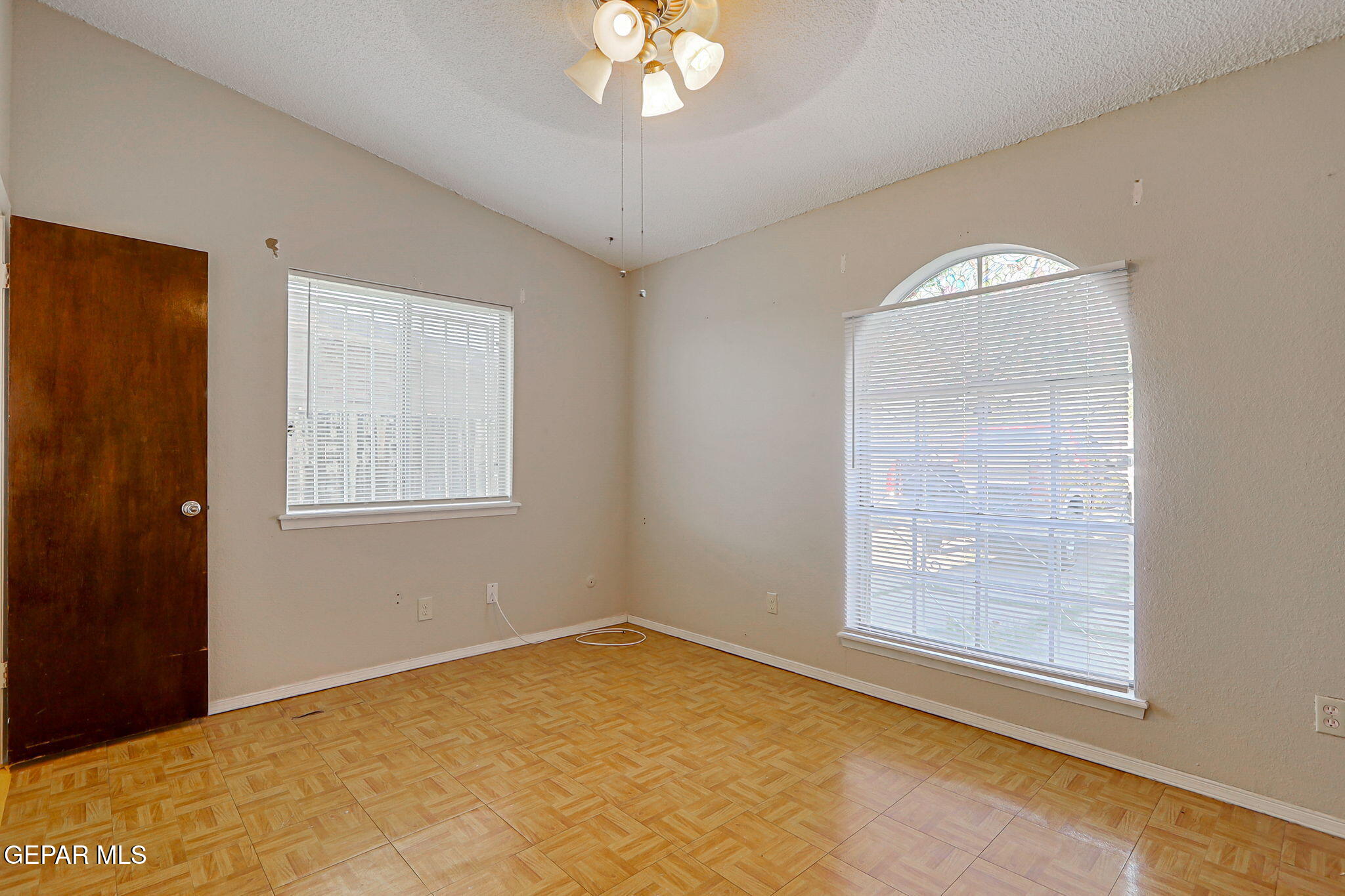9108 Morelia Road El Paso, TX 79907 - Photo 21 of 35 a view of an empty room with a window