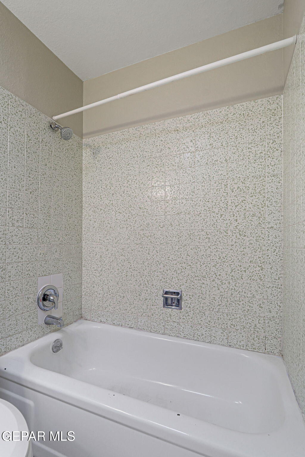 9108 Morelia Road El Paso, TX 79907 - Photo 27 of 35 a bathroom with a shower and a bathtub