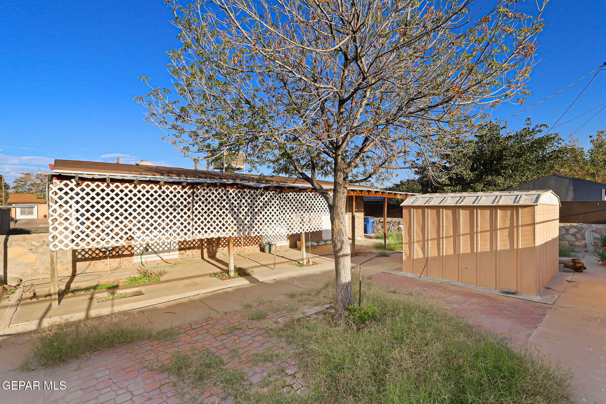 9108 Morelia Road El Paso, TX 79907 - Photo 4 of 35 a front view of a house with a yard
