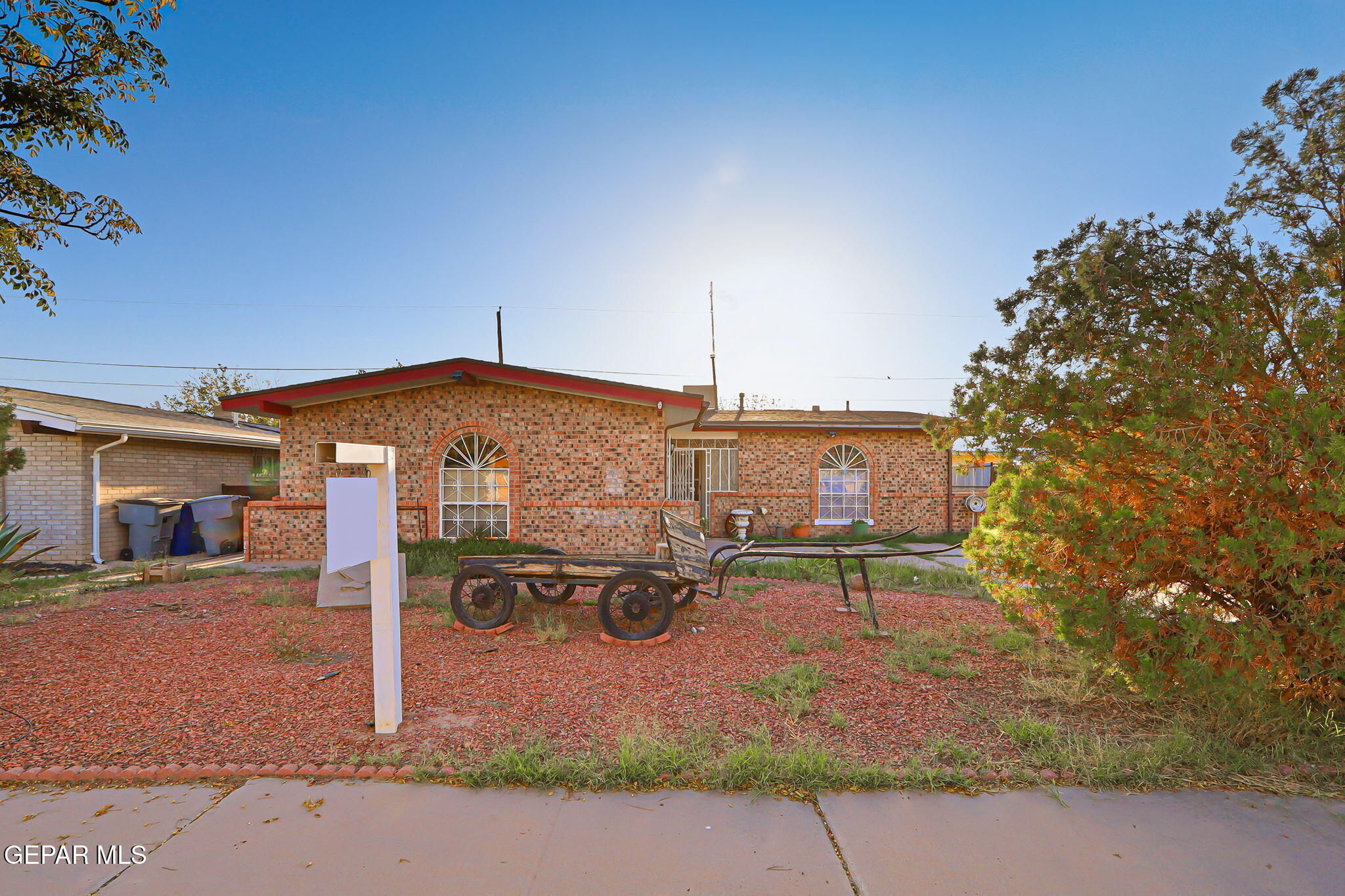 9108 Morelia Road El Paso, TX 79907 - Photo 6 of 35 a street view with tall buildings and a street sign