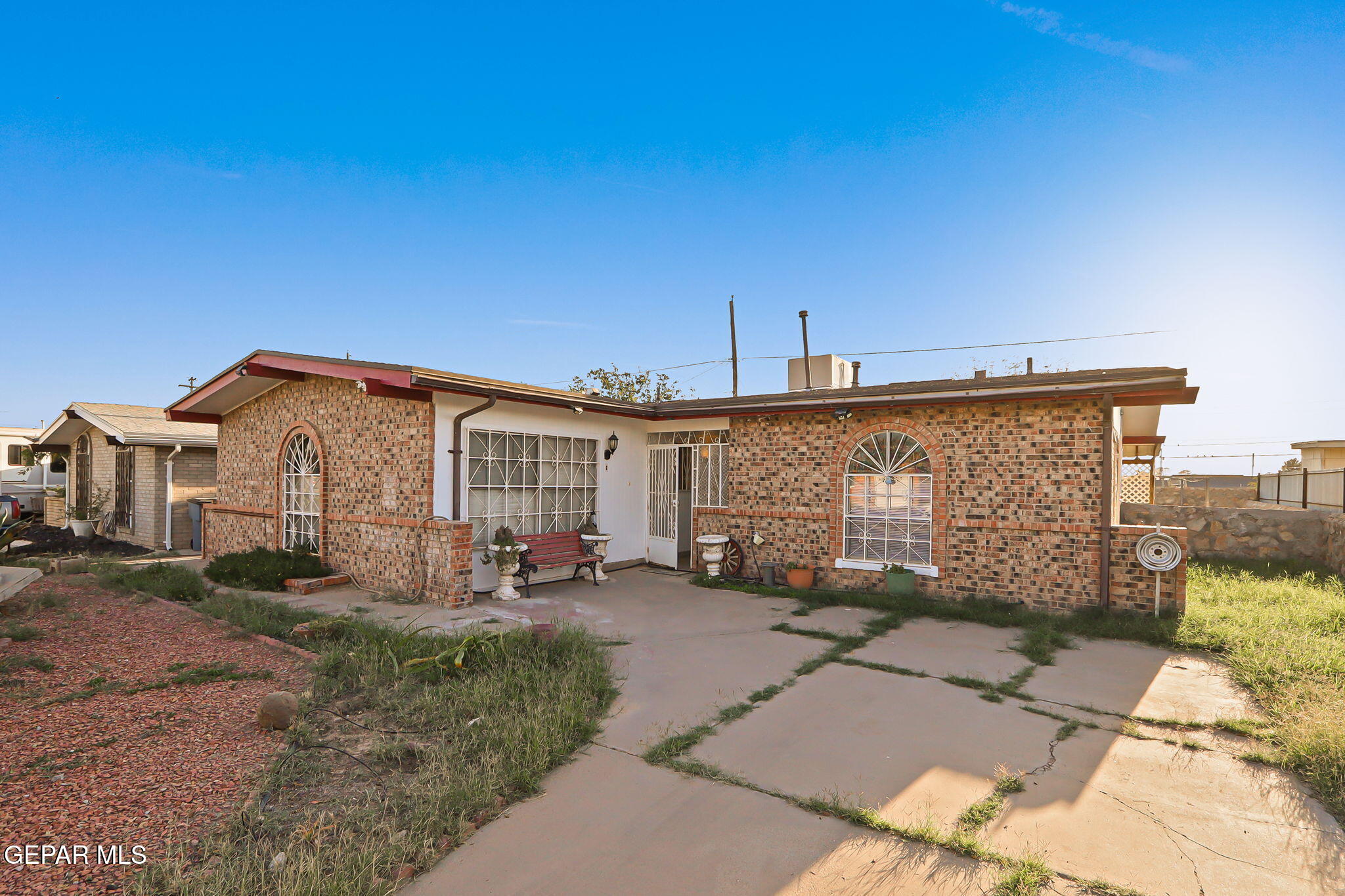 9108 Morelia Road El Paso, TX 79907 - Photo 8 of 35 a front view of a house with garden