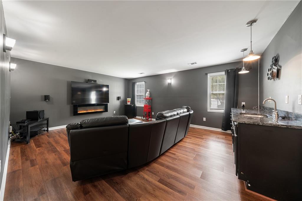 55 Meridian Point Dallas, GA 30132 - Photo 26 of 45 a living room with furniture and a flat screen tv