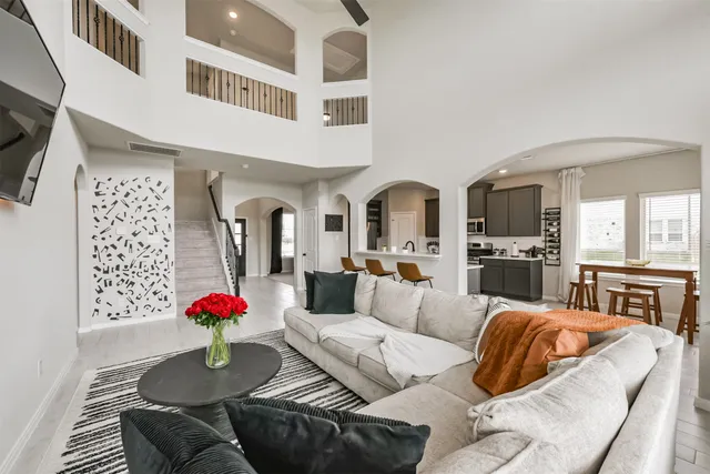a living room with furniture and a flat screen tv