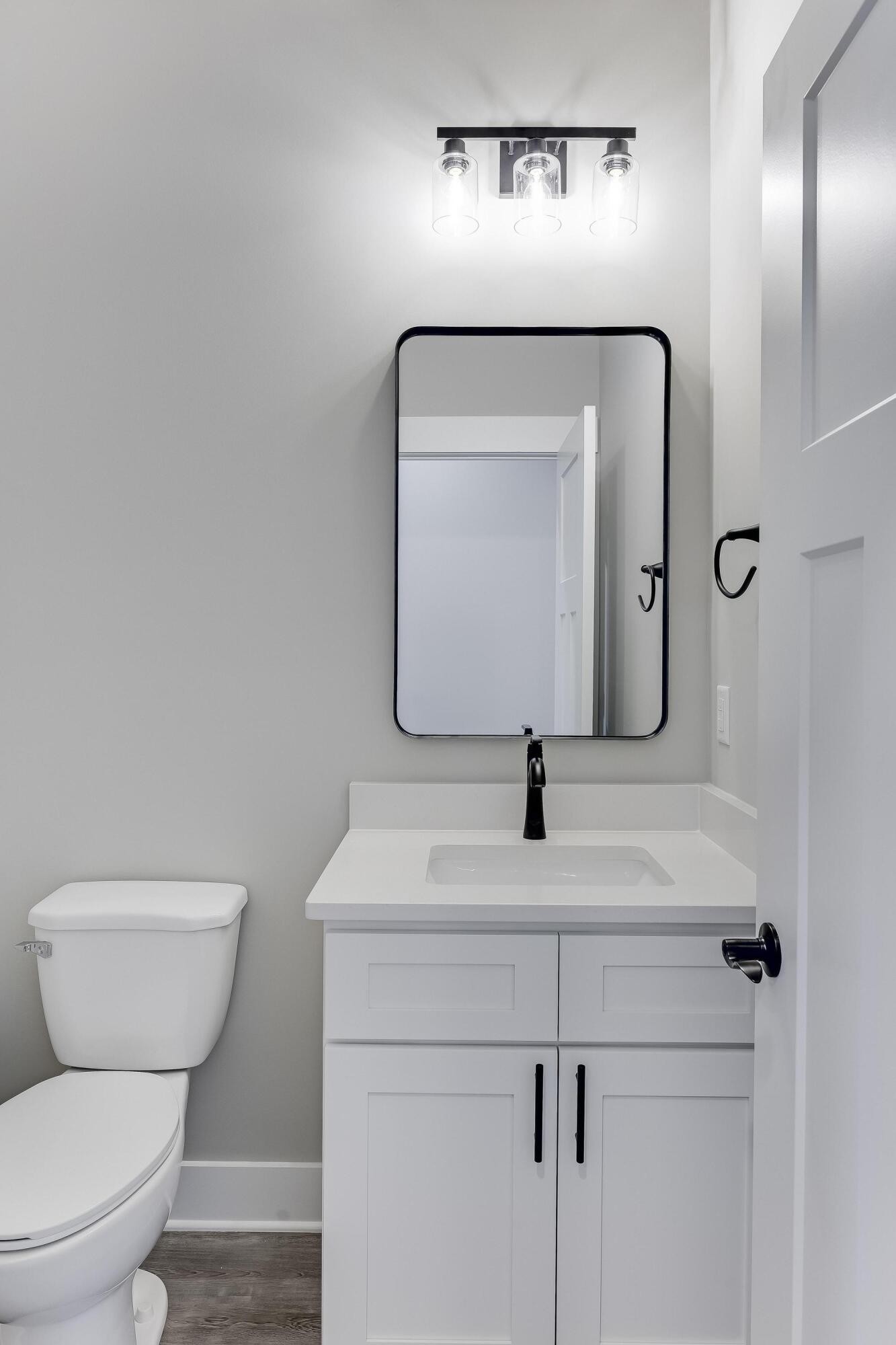 2151 Old Federal Road Ocoee, TN 37361 - Photo 23 of 31 a bathroom with a toilet sink and mirror