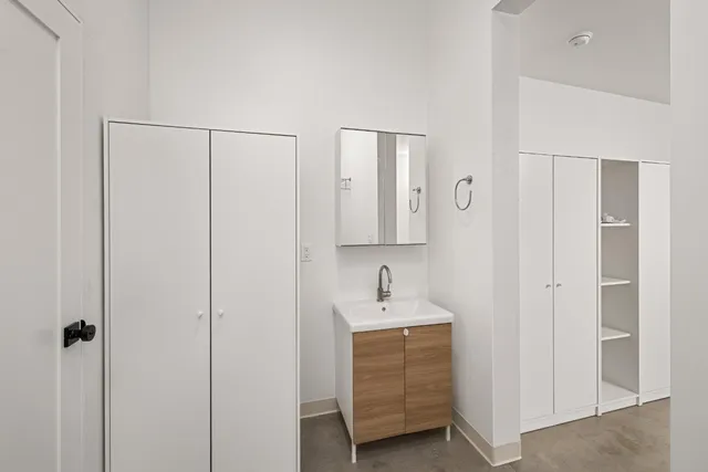 a bathroom with a sink and a mirror