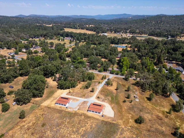 an aerial view of residential house with outdoor space