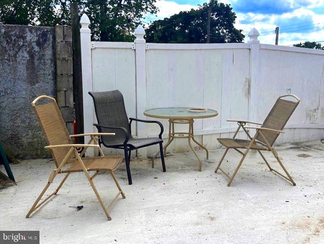 856 Chester Pike Prospect Park, PA 19076 - Photo 11 of 14 a view of a chairs and table in the backyard