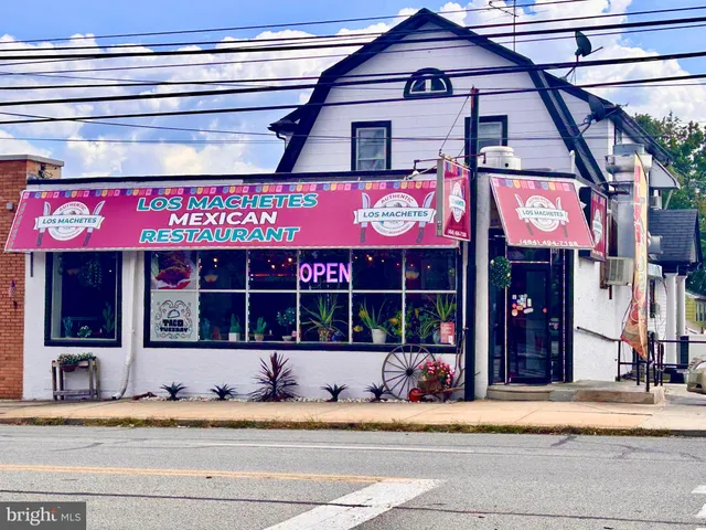 a view of a store with parking