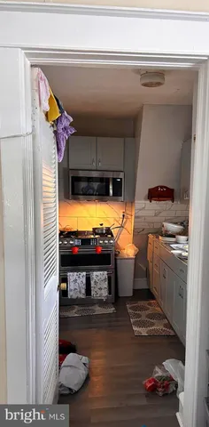 a living room with a window and furniture