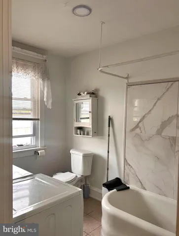 a view of a chairs and table in the balcony