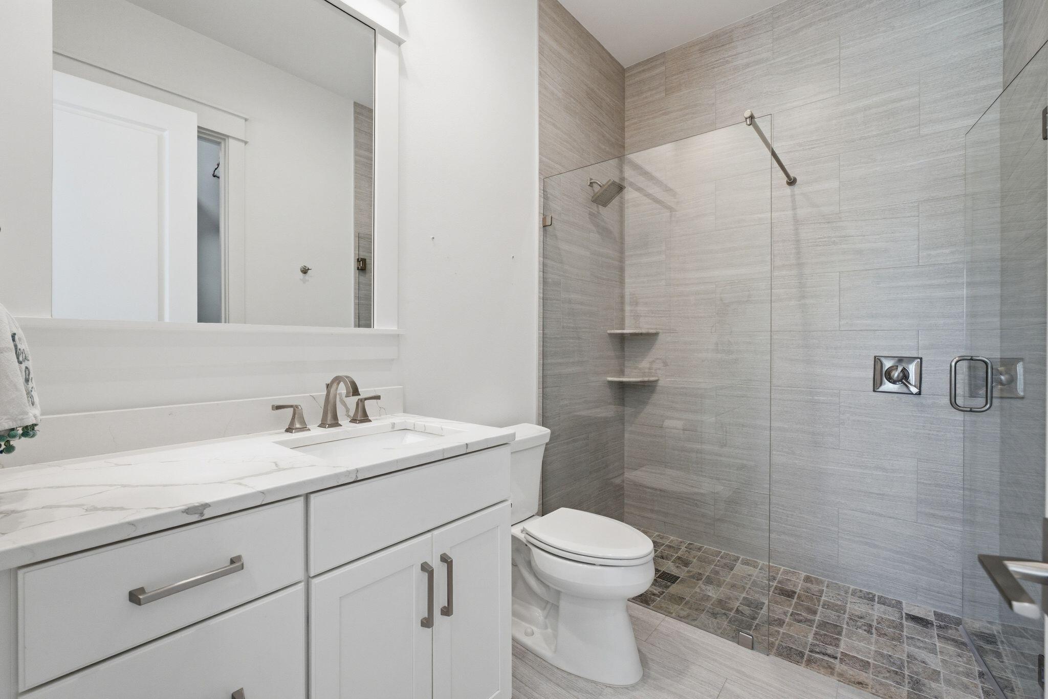 133 Sandchase Circle, Unit LOT 15 Inlet Beach, FL 32461 - Photo 21 of 47 a bathroom with a sink a toilet and shower