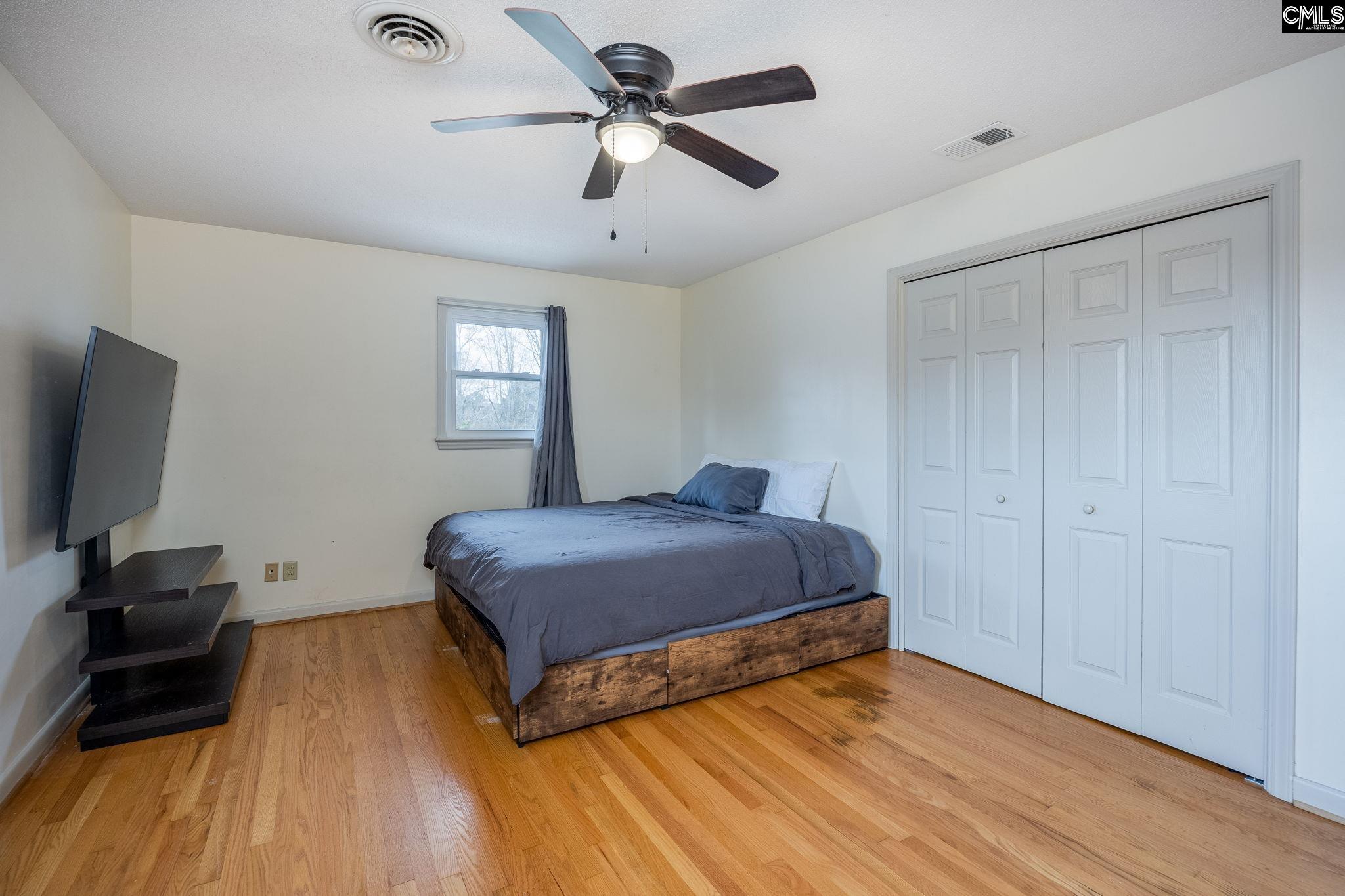 560 Edisto Street Batesburg, SC 29006 - Photo 24 of 49 a bedroom with a bed and a flat tv screen on the dresser