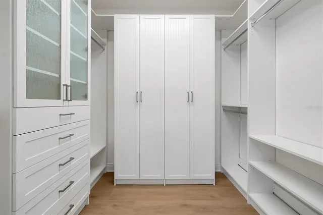 a bathroom with double sink and a bathtub