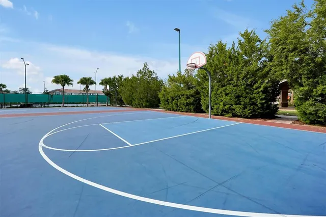 an aerial view of residential houses with yard